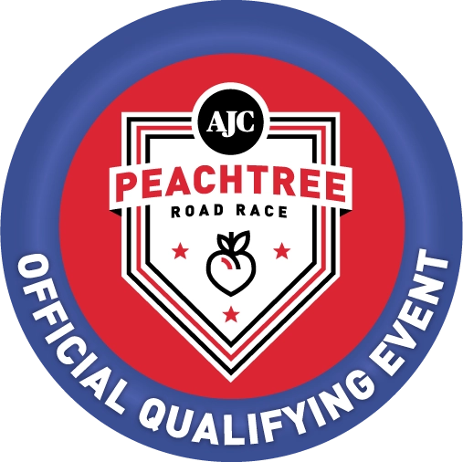 A badge with the ajc peachtree road race logo.