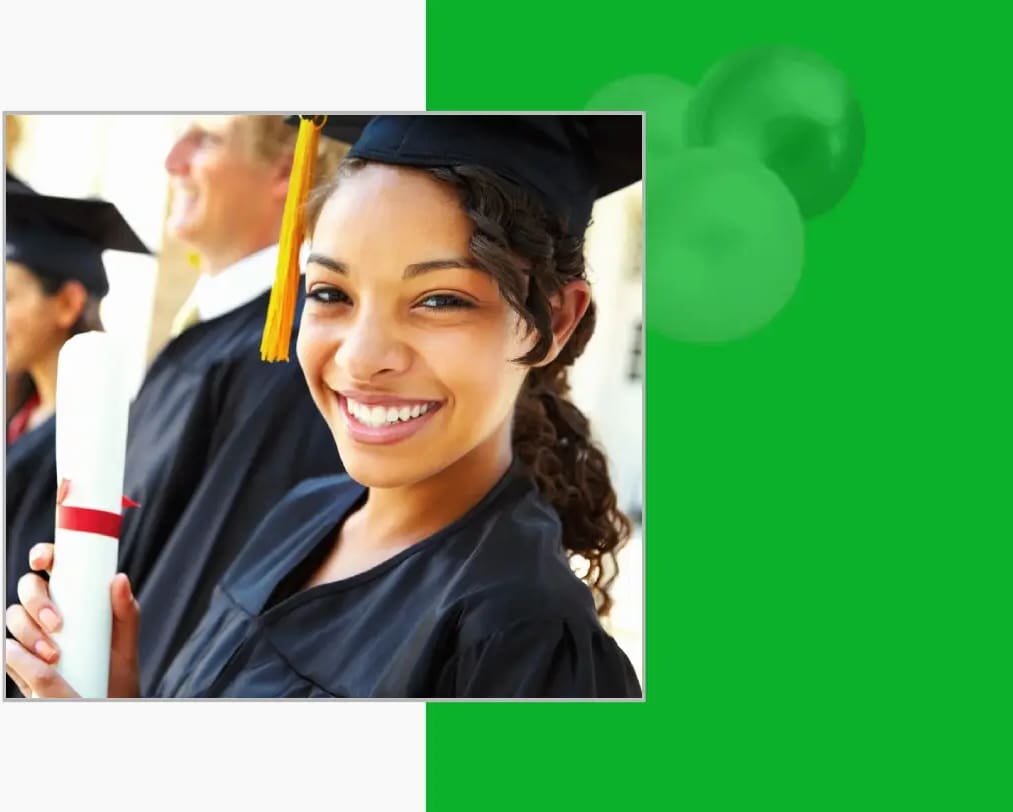 A woman in cap and gown smiling for the camera.